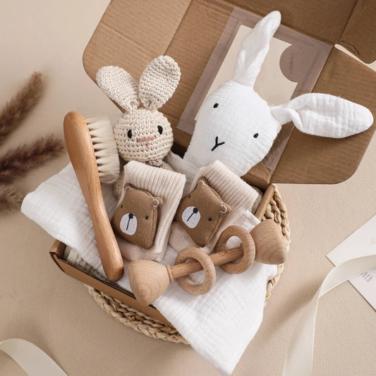 7-Piece Newborn Essentials Gift Box with baby gifts and wooden toys