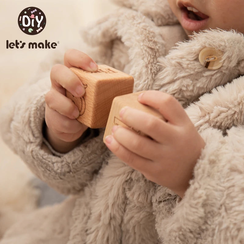 baby with building block in hand