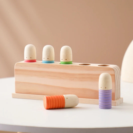 Wooden montessori toy with 5 pop figures in red, green, blue, purple and orange. 