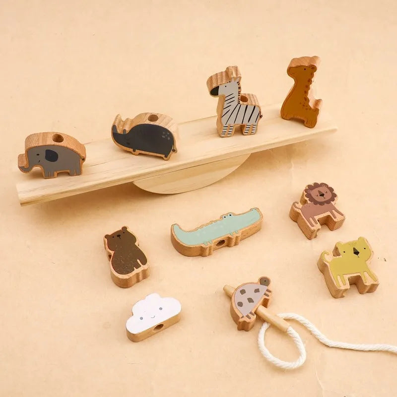 balance toy figures on cream background