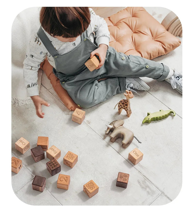 little boy playing with the building blocks toy