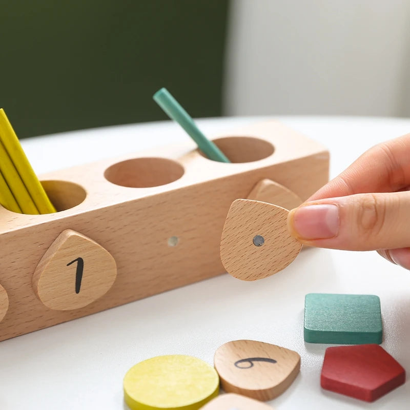 wooden montessori math lerning toy, image shows that the pieces are magnetic