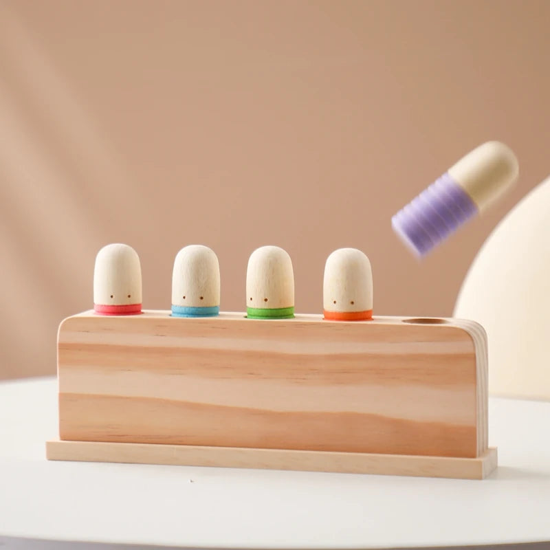 wooden toy game with colourful pop up figures