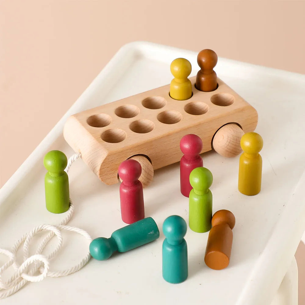 Rainbow Riders Trolley 10 coloured wooden pegs in a car with pegs out of car 