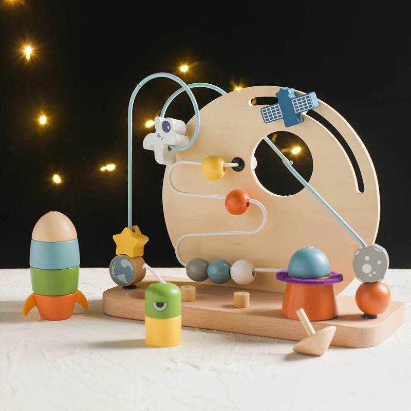 wooden toy space planet bead game with black background
