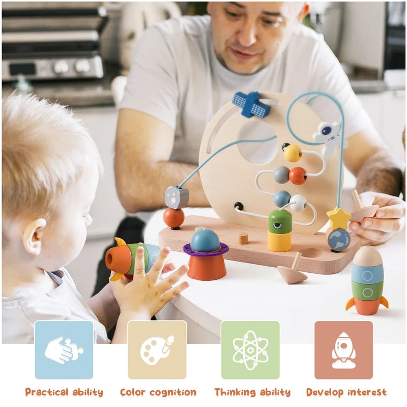 childrens wooden space toy, child playing the space toy with a parent. 