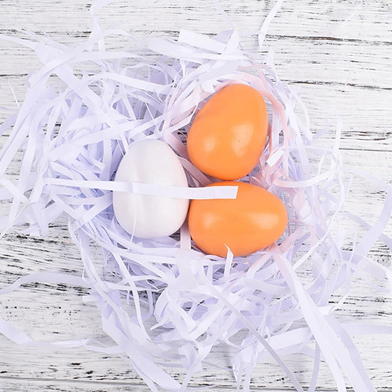 three wooden eggs lying on a wood floor 
