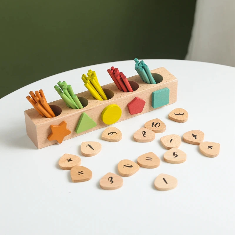 math montessori toy on a table with 5 different colour sticks to out in correct whole in toy