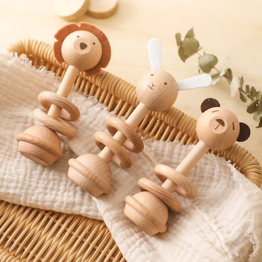 three wooden animal rattles